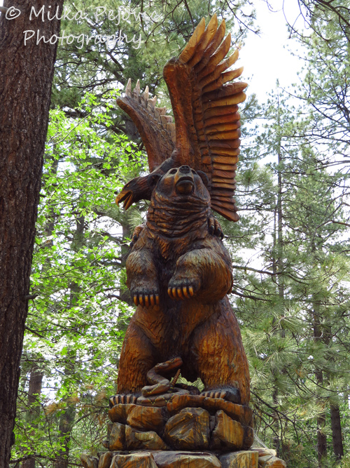 Travel theme: Wood sculpture of a lifesize bear and eagle