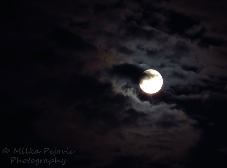 A word a week challenge: atmospheric - moon behind the clouds