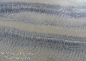 Patterns in wet sand: dark and light sand
